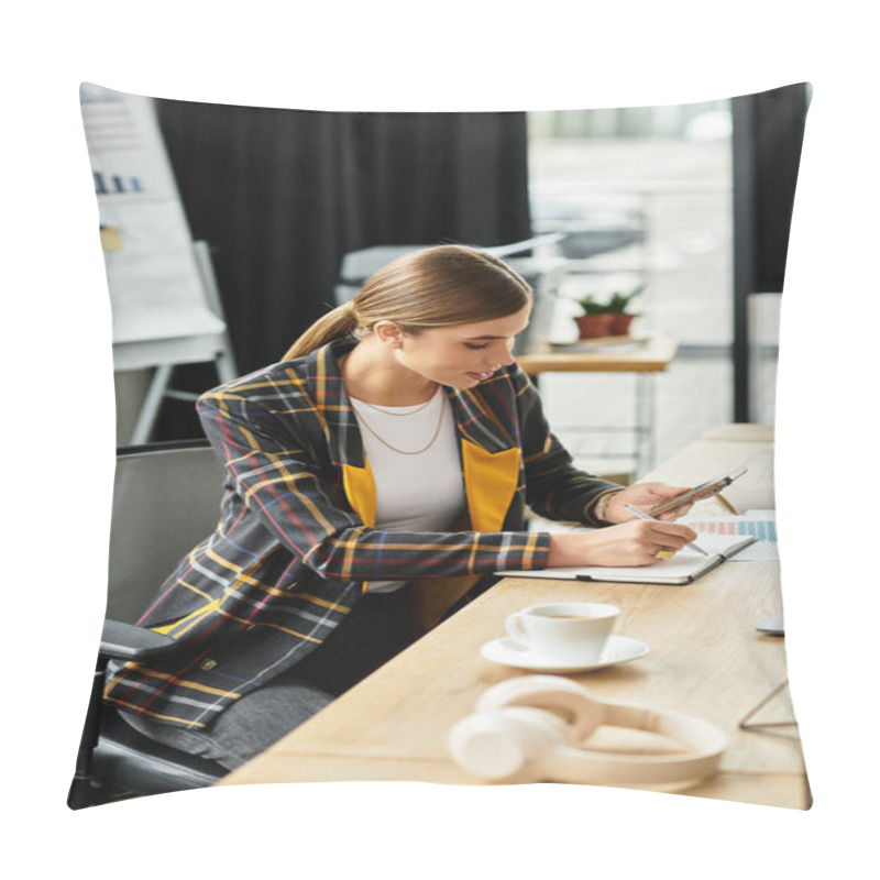 Personality  Young Woman In A Stylish Blazer Writes Notes While Using Her Smartphone In An Office. Pillow Covers