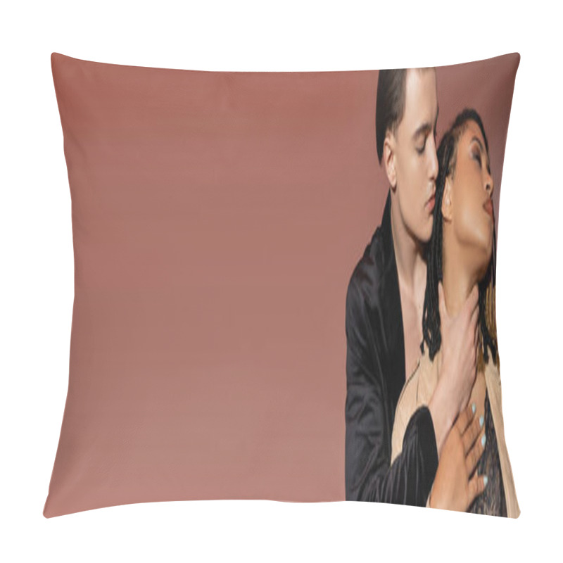 Personality  Fashionable And Handsome Man In Black Silk Blazer Embracing Neck Of Passionate African American Woman With Dreadlocks Dressed In Lace Lingerie And Trench Coat On Pinkish Beige Background, Banner Pillow Covers