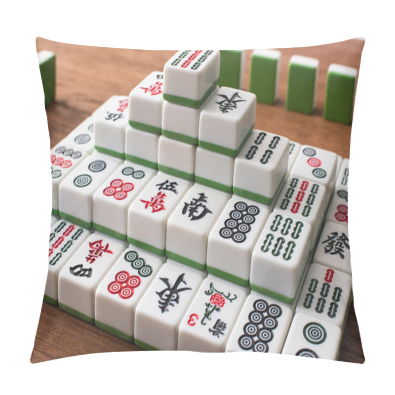 Personality  KYIV, UKRAINE - JANUARY 30, 2019: Rows And Pyramid Made Of Mahjong Game Tiles On Wooden Table Pillow Covers