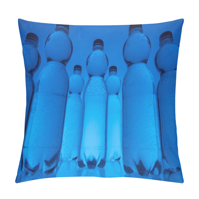 Personality  Toned Image Of Plastic Water Bottles In Rows On Neon Blue Background Pillow Covers