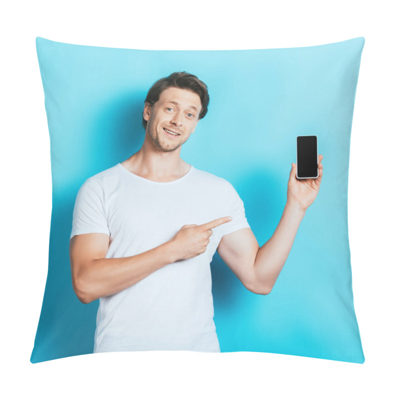 Personality  Young Man In White T-shirt Pointing With Finger At Smartphone On Blue Background Pillow Covers