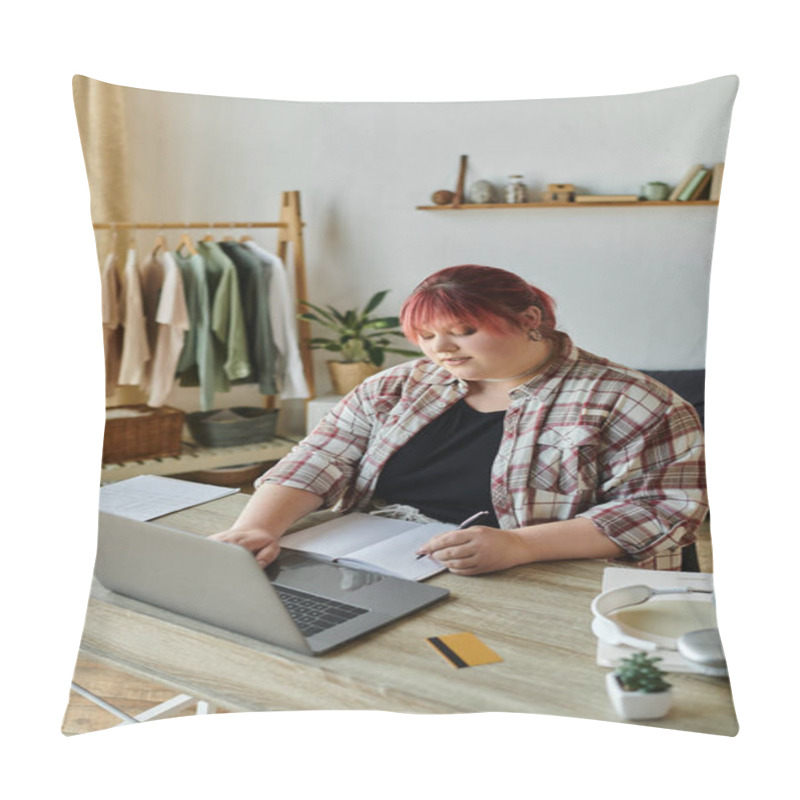 Personality  A Woman With Pink Hair Works On Her Laptop While Taking Notes In A Notebook At Her Home Office Desk. Pillow Covers