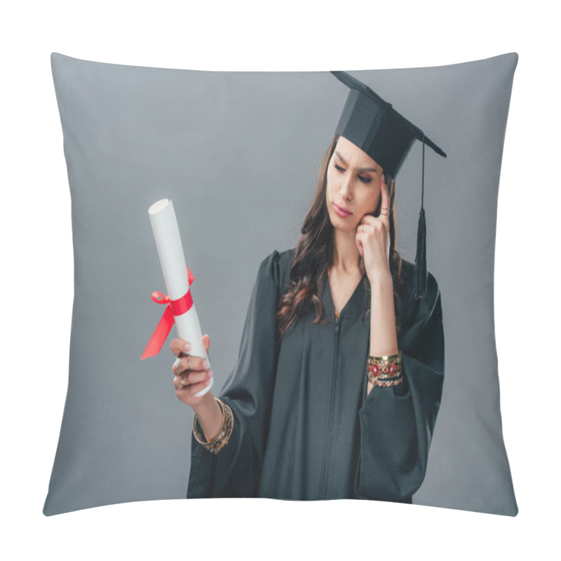 Personality  Thoughtful Indian Student In Academic Gown And Graduation Hat Looking At Diploma, Isolated On Grey Pillow Covers