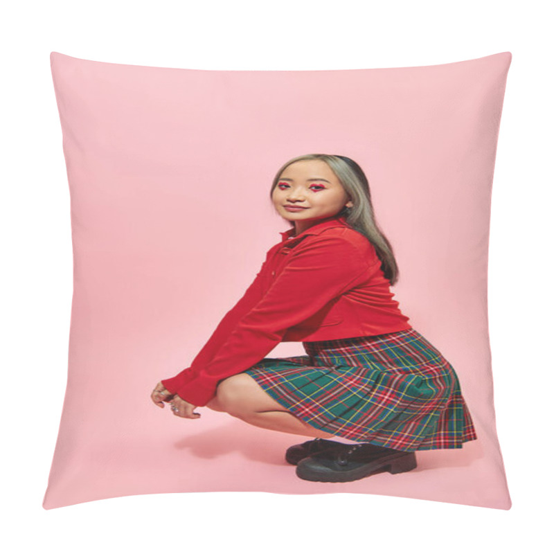 Personality  Full Length Of Young Asian Woman With Heart Shaped Eye Makeup And Plaid Skirt Sitting On Pink Pillow Covers