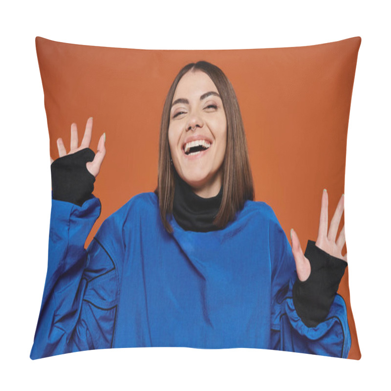 Personality  Excited Young Woman With Pierced Nose Looking At Camera And Smiling On Orange Backdrop, Blue Jacket Pillow Covers