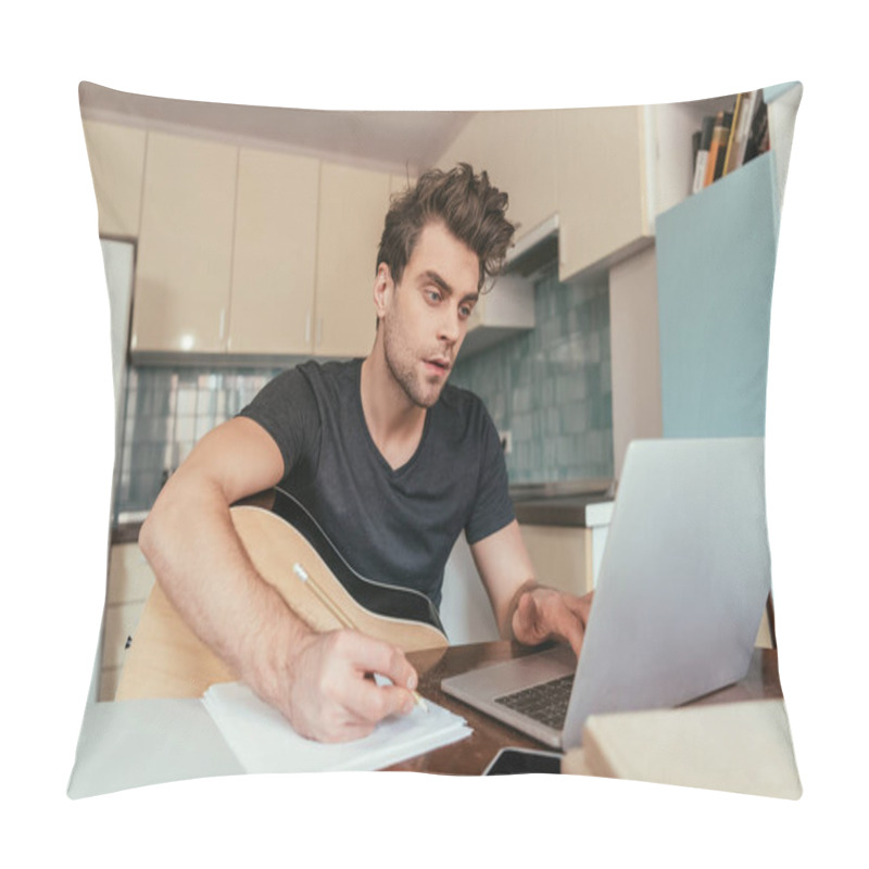 Personality  Concetrated Young Man With Guitar Holding Pencil And Using Laptop Pillow Covers