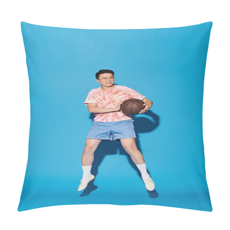 Personality  A Stylish Young Man Poses With A Basketball Against A Vibrant Blue Backdrop, Exuding Confidence And Athleticism. Pillow Covers