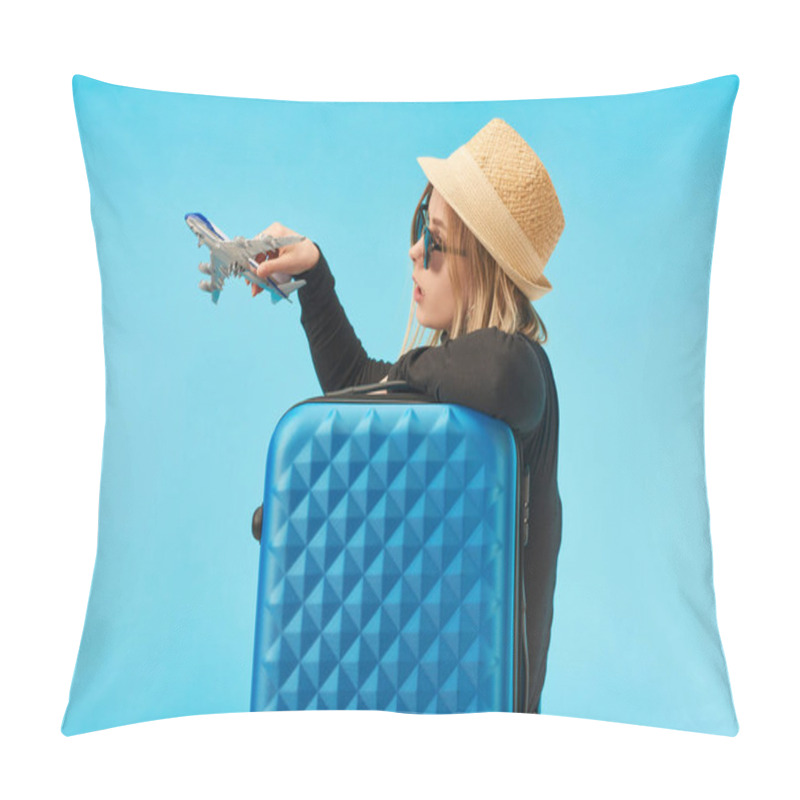 Personality  Blonde Girl In Sunglasses And Straw Hat Playing With Toy Airplane Near Blue Travel Bag Isolated On Blue Pillow Covers