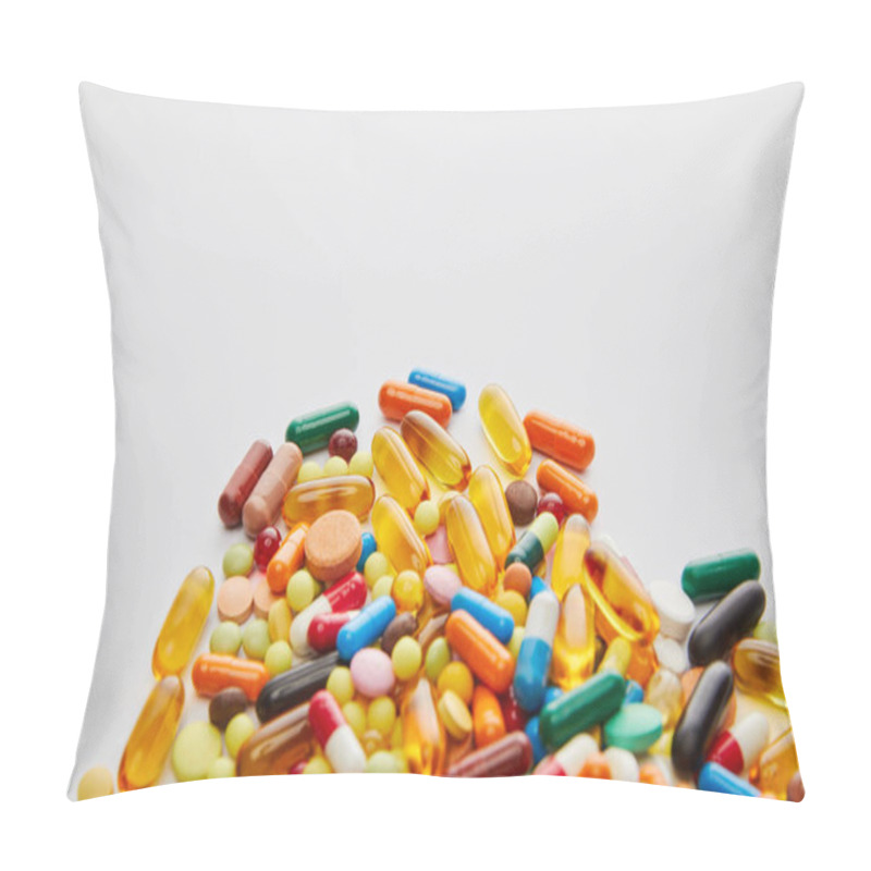 Personality  High angle view of bright capsules and pills on white background pillow covers