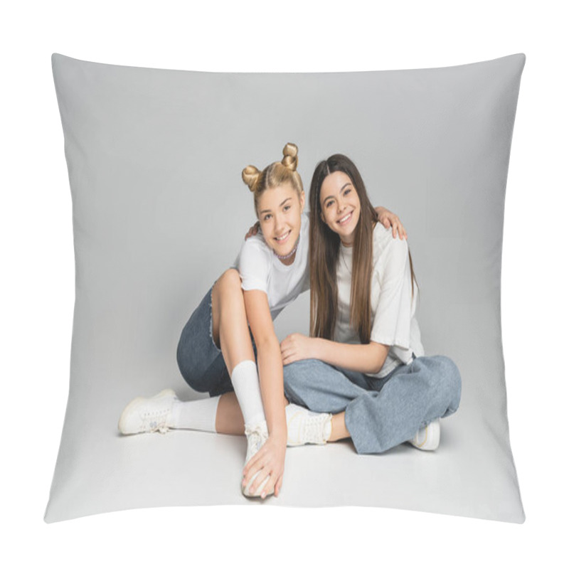 Personality  Smiling Blonde Teenage Girl In White T-shirt And Denim Shorts Hugging Girlfriend And Looking At Camera While Sitting On Grey Background, Lively Teenage Girls Concept, Friendship And Bonding Pillow Covers