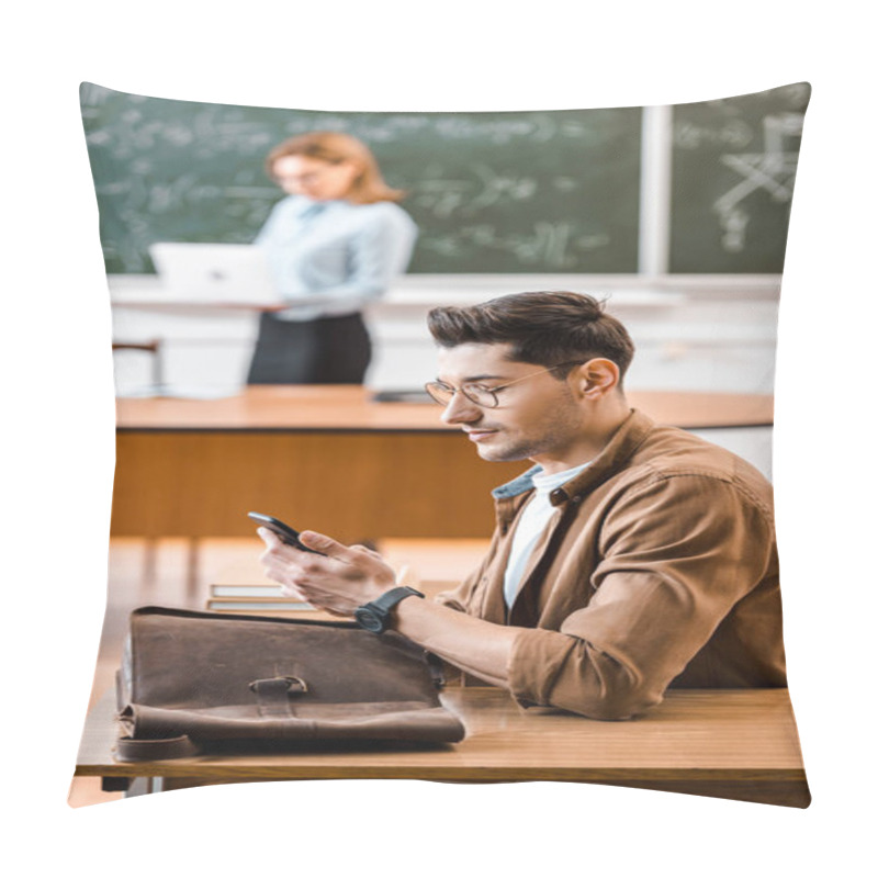 Personality  Selective Focus Of Student Using Smartphone In Classroom With Teacher On Background  Pillow Covers