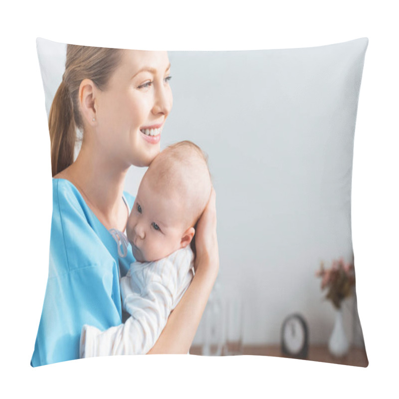 Personality  Side View Of Happy Young Mother Holding Adorable Baby And Looking Away In Hospital Room Pillow Covers