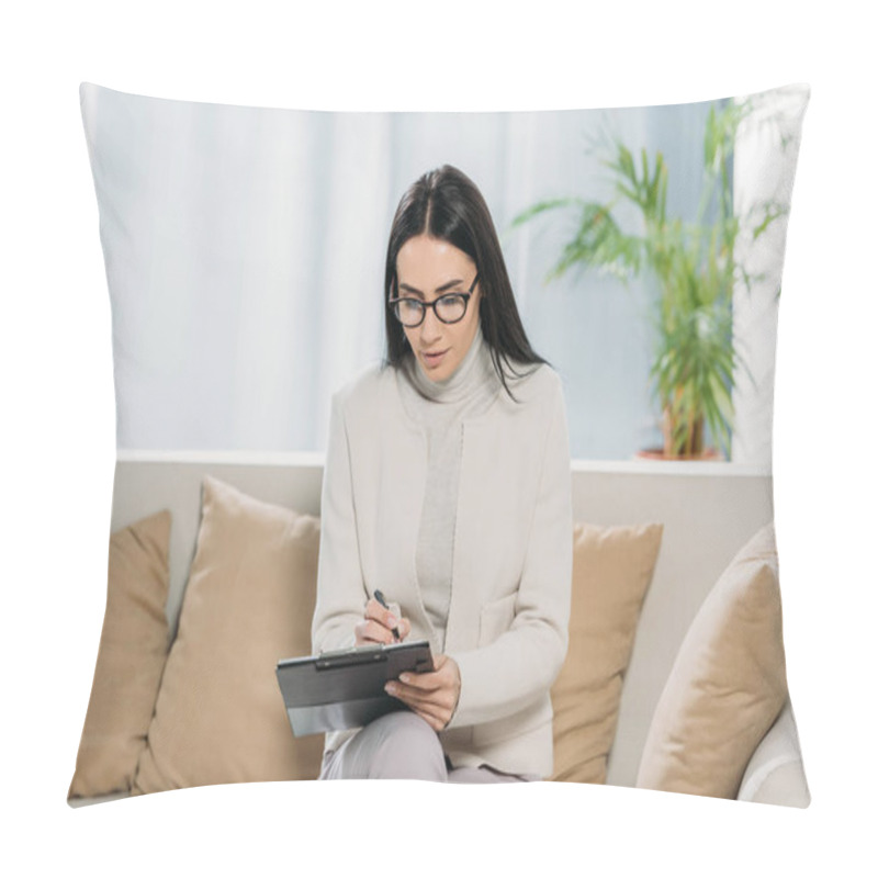 Personality  Young Female Psychologist In Eyeglasses Sitting On Couch And Writing On Clipboard Pillow Covers