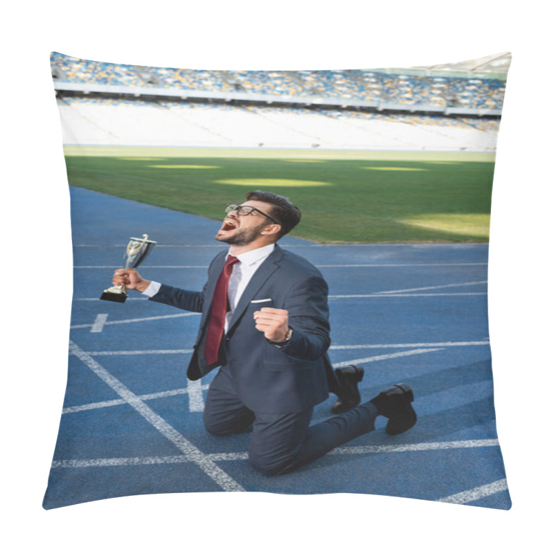 Personality  Young Businessman In Suit Standing On Knees On Running Track With Trophy And Scream At Stadium Pillow Covers