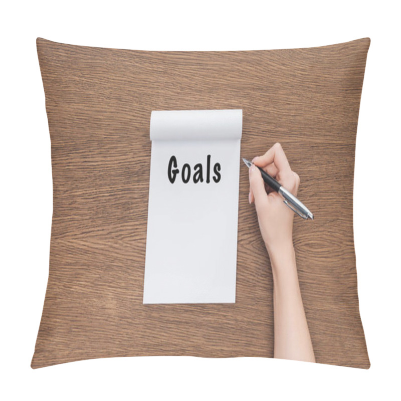 Personality  Cropped View Of Woman Holding Pen And Notebook With 'goals' Lettering On Wooden Background  Pillow Covers