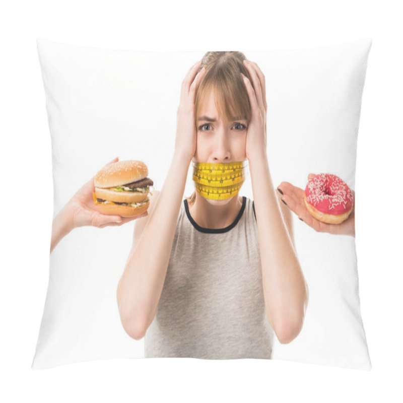 Personality  Young Woman With Mouth Tied In Measuring Tape Screaming While People Giving Her Junk Food Isolated On White Pillow Covers