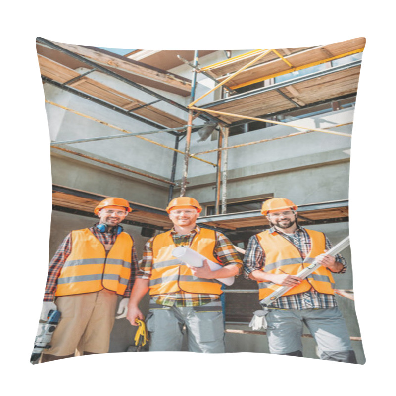 Personality  Group Of Smiling Equipped Builders Looking At Camera At Construction Site Pillow Covers