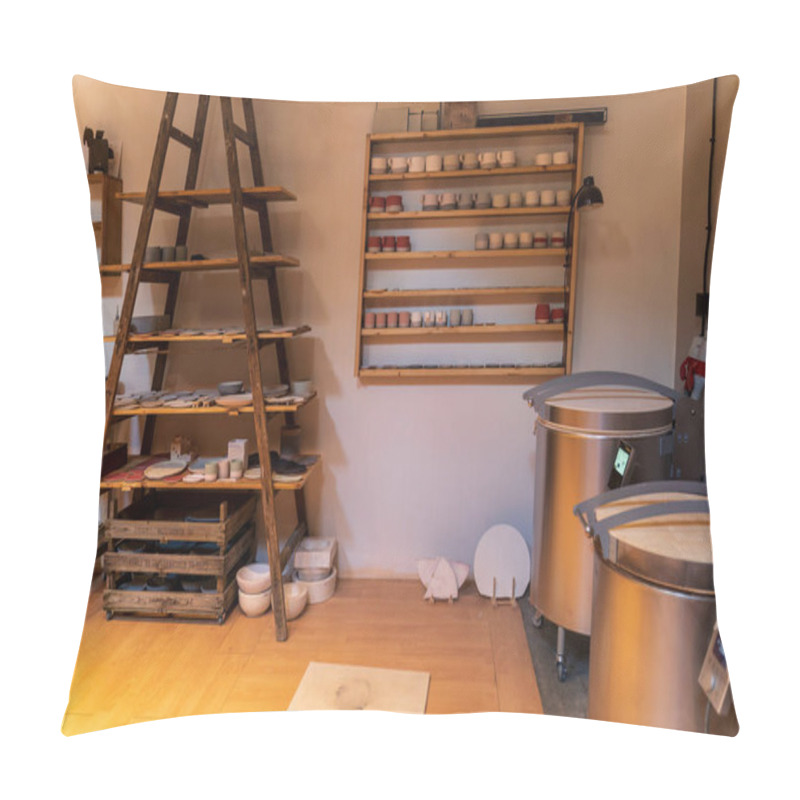 Personality  A Ceramic Workshop Featuring Shelves Filled With Pottery, A Pottery Wheel, And Kilns. Pillow Covers