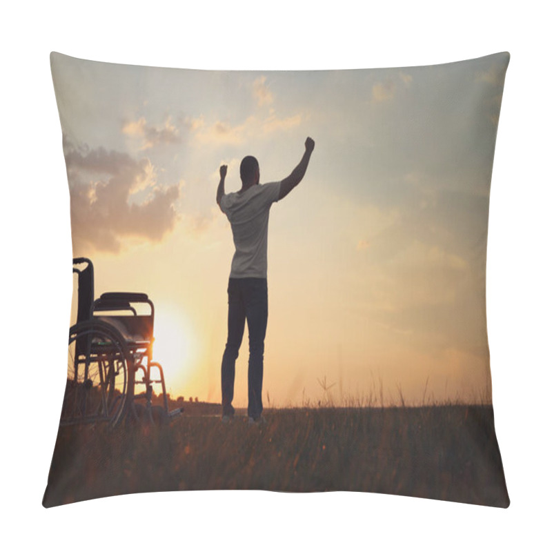 Personality  Man Raising Hands Up To Sky Near Wheelchair At Sunset, Back View. Healing Miracle Pillow Covers