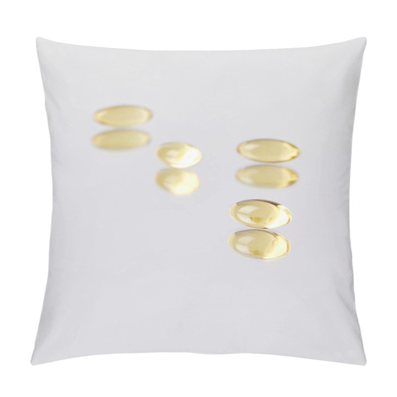 Personality  Close-up Shot Of Omega Fish Hat Supplement Capsules On Reflective Surface Pillow Covers