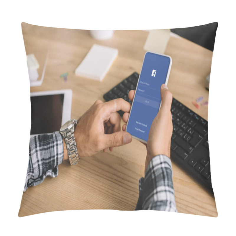 Personality  Cropped Shot Of Man Using Smartphone With Facebook App On Screen At Workplace Pillow Covers