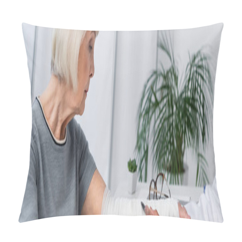 Personality  Side View Of Senior Woman With Broken Arm Sitting Near African American Doctor, Banner  Pillow Covers