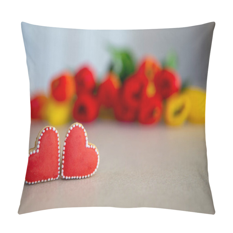 Personality  Heart-shaped Cookies With Tulip Bouquet Background. Two Red Heart-shaped Cookies With White Icing Are Displayed On A Tabletop, With A Blurred Bouquet Of Red And Yellow Tulips Behind Them Pillow Covers