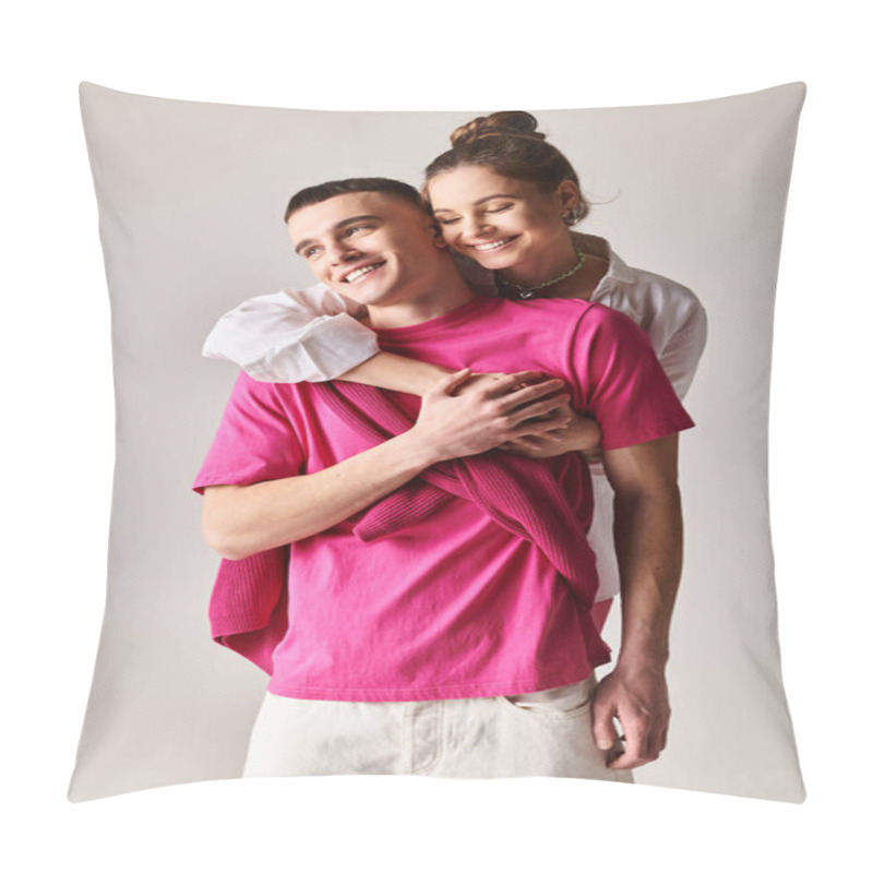 Personality  A Man Affectionately Hugs A Woman Wearing A Pink Shirt In A Stylish Studio Setting With A Grey Background. Pillow Covers