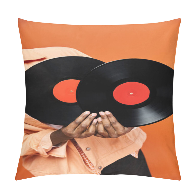 Personality  Handsome African American Man Holding Two Vinyl Records Against An Orange Background. Pillow Covers