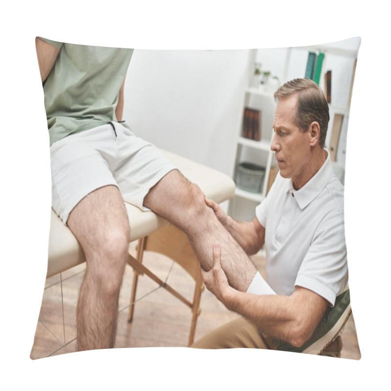 Personality  Handsome Mature Doctor In Medical Uniform Helping His Patient To Rehabilitate His Knee Muscles Pillow Covers