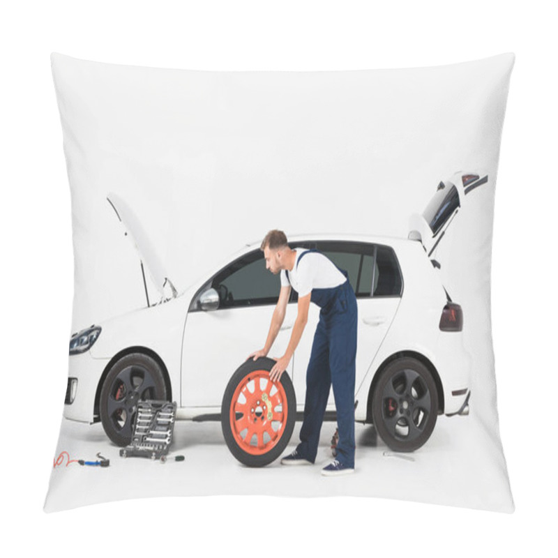 Personality  Side View Of Auto Mechanic Pushing Tire To Change Old One On White Pillow Covers