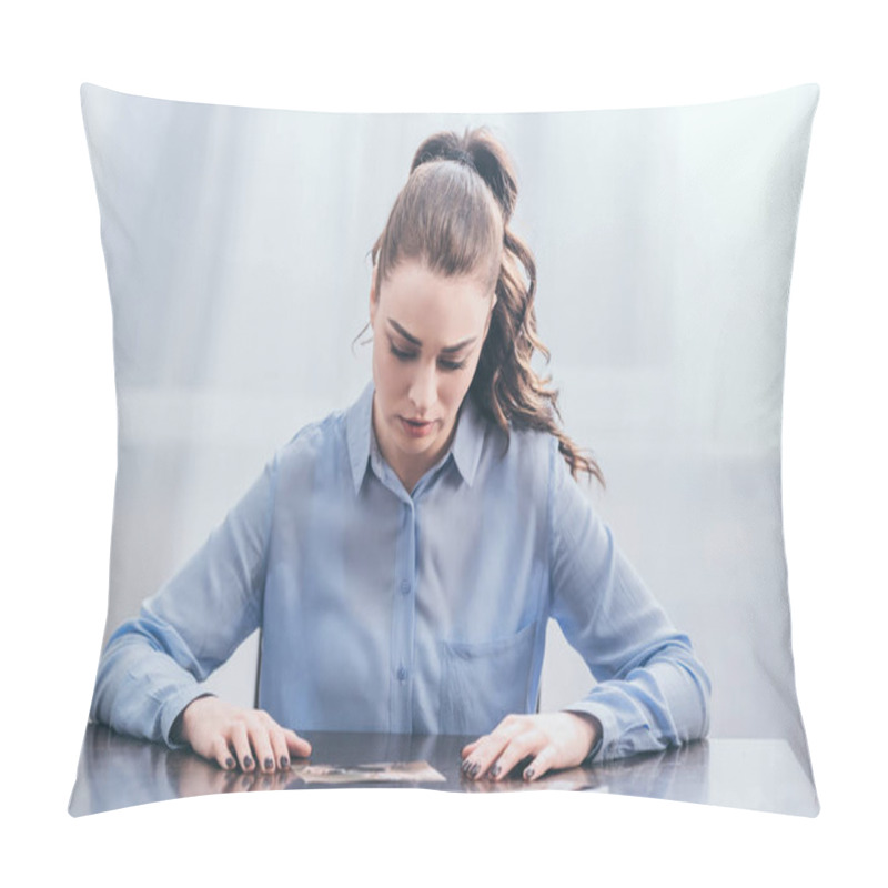 Personality  Upset Woman In Blue Blouse Sitting At Wooden Table With Smartphone And Looking At Photo In Room, Grieving Disorder Concept Pillow Covers