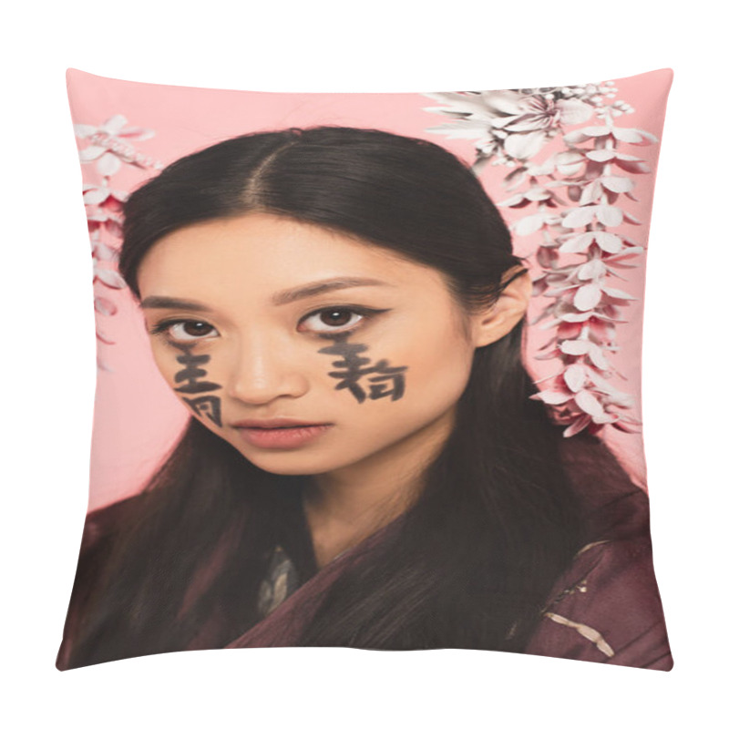 Personality  Young Asian Woman With Hieroglyphs On Face Looking At Camera Isolated On Pink  Pillow Covers