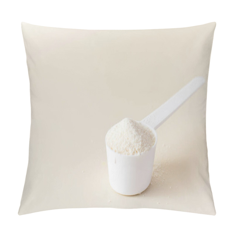 Personality  A Scoop With Hydrolyzed Collagen Powder On A Beige Background. The Concept Of Food Additives, Healthy. Pillow Covers