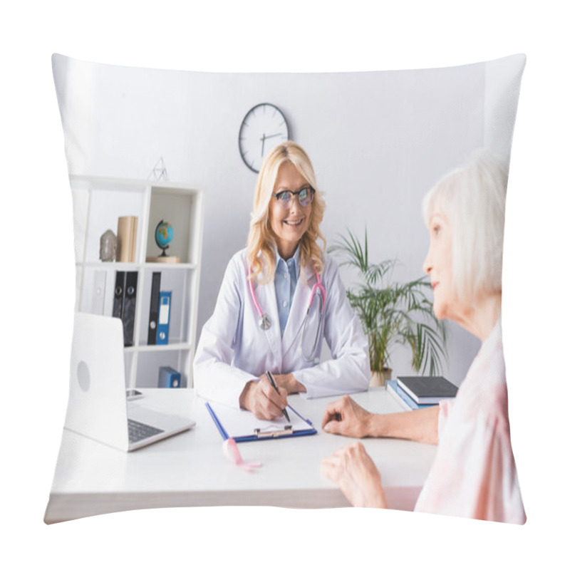 Personality  Selective Focus Of Doctor Writing On Clipboard And Looking At Patient In Clinic Pillow Covers