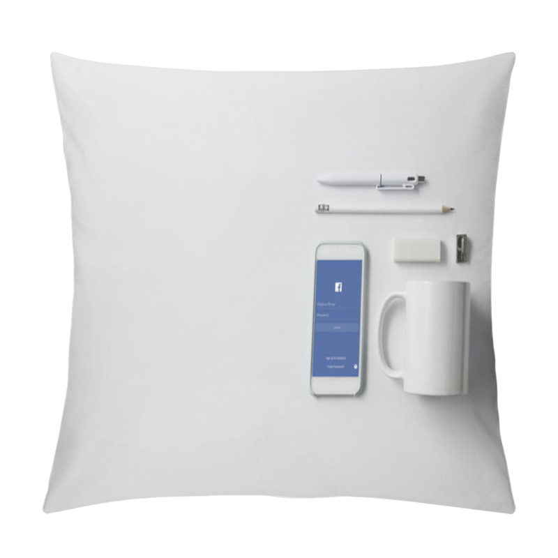 Personality  Top View Of Smartphone With Facebook App And Various Supplies On White Tabletop Pillow Covers