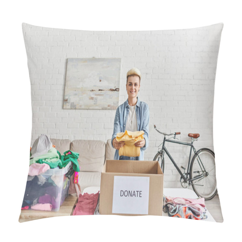 Personality  Young And Positive Woman With Trendy Hairstyle Smiling At Camera And Holding Yellow Jumper Near Donation Box And Plastic Container With Clothes, Sustainable Living And Social Responsibility Concept Pillow Covers