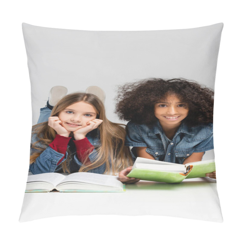 Personality  Happy Multicultural Schoolkids Smiling At Camera While Lying With Books On Grey Pillow Covers