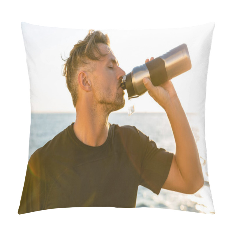 Personality  Side View Of Handsome Adult Man Drinking Water From Fitness Bottle On Seashore In Front Of Sunrise Pillow Covers