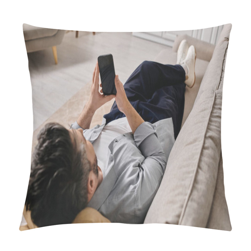 Personality  A Bearded Man In Casual Attire Lays Back On A Couch, Browsing His Smartphone. Pillow Covers