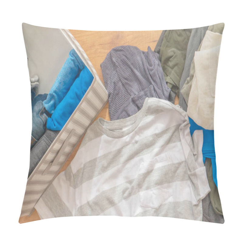 Personality  Vertical Storage Of Clothing, Marie Kondo Tidying Up Method, Room Cleaning Concept. Top View Pillow Covers