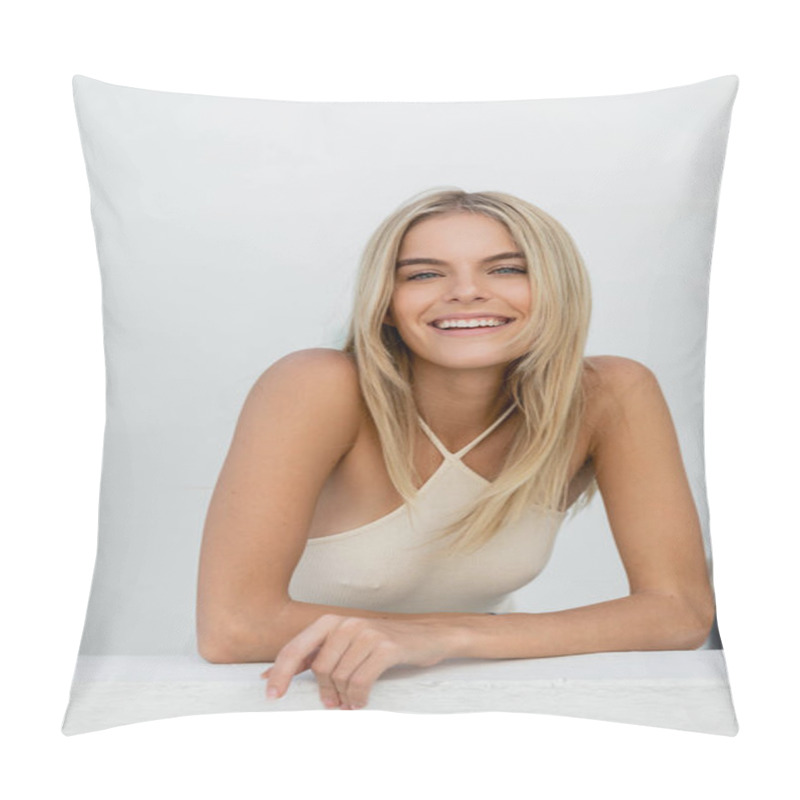 Personality  A Young Blonde Woman Sitting Gracefully Posing Against A White Wall In Miami. Pillow Covers