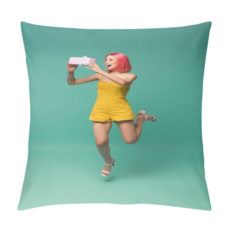 Personality  Full Length Of Cheerful Young Woman With Pink Dyed Hair Jumping And Catching Present On Blue  Pillow Covers