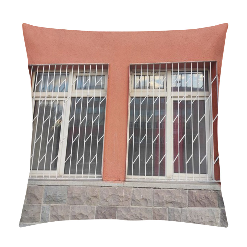 Personality  Orange Wall Of Restraint: A Symbol Of Duality In Freedom And Security, Reflected Through Grated Windows, Solid Stone, And Subtle Urban IsolationA Metaphor For Physical And Emotional Barriers. Pillow Covers