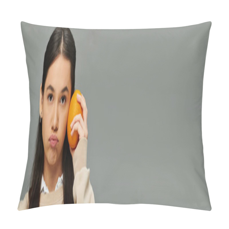 Personality  A Young Woman In Fashionable Attire Holds An Orange To Her Cheek, Lost In Thought And Emotion. Pillow Covers