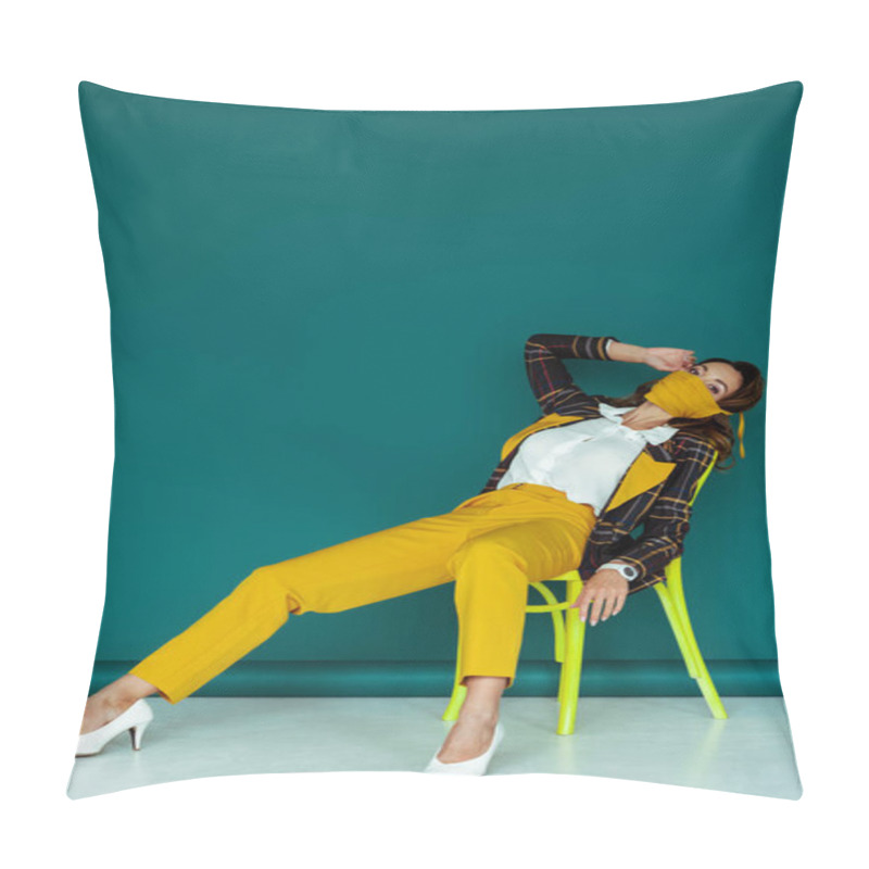 Personality  Stylish Woman In Yellow Mask And Plaid Blazer Sitting On Chair On Blue Pillow Covers