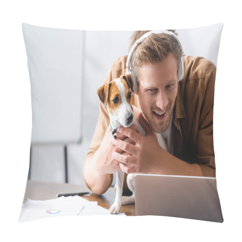 Personality  Young Businessman In Wireless Headphones Cuddling Jack Russell Terrier Dog At Workplace Near Laptop Pillow Covers