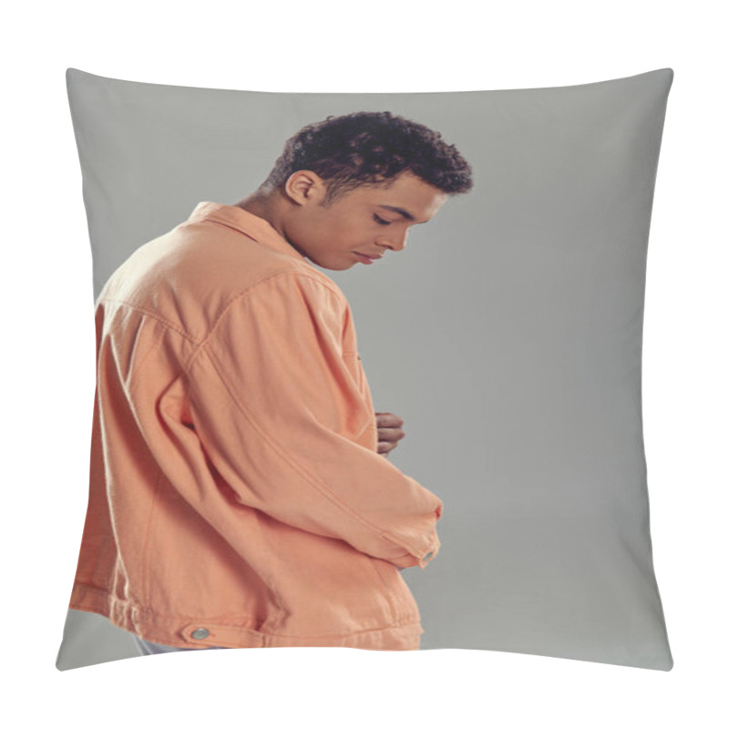 Personality  Curly Man In Peach Shirt Standing Against Grey Wall, Showcasing His Impeccable Fashion Sense Pillow Covers