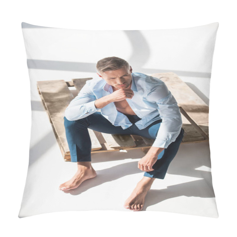 Personality  High Angle View Of Handsome Adult Man Sitting On Wooden Pallet On White Pillow Covers