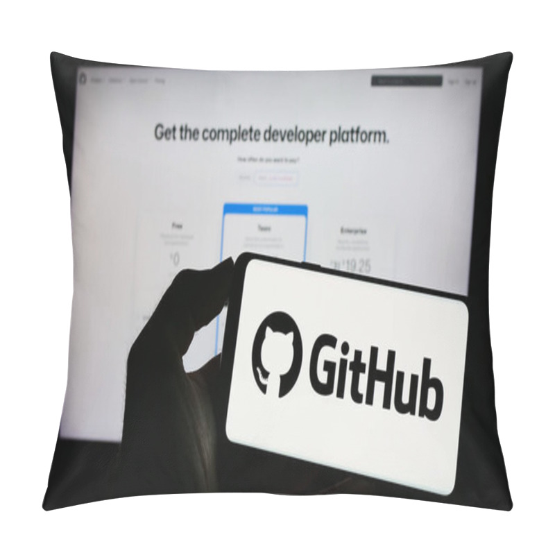 Personality  Stuttgart, Germany - 07-09-2023: Person Holding Cellphone With Logo Of US Software Development Company GitHub Inc. On Screen In Front Of Business Webpage. Focus On Phone Display. Pillow Covers